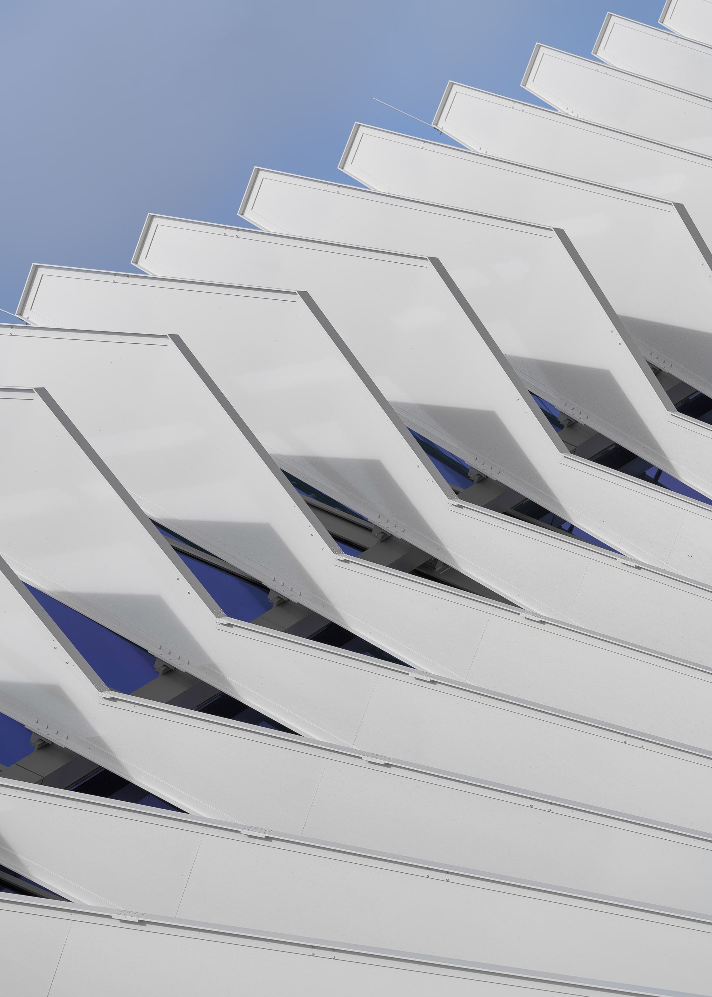 Rows of white water-jet-cut aluminum sunshade fins on the Miami Beach Convention Center