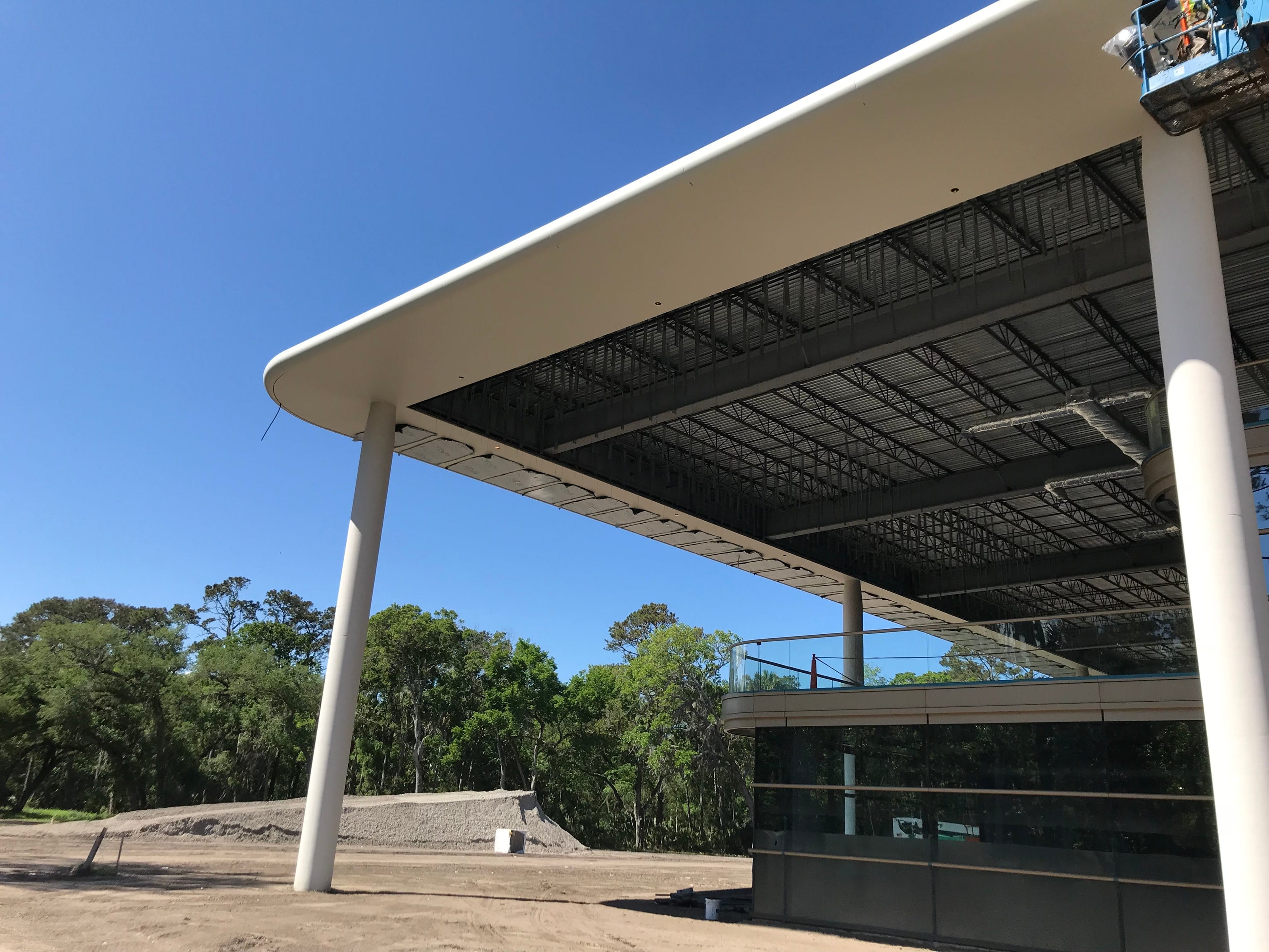 Curved white canopy edge and slender column at PGA Tour Headquarters