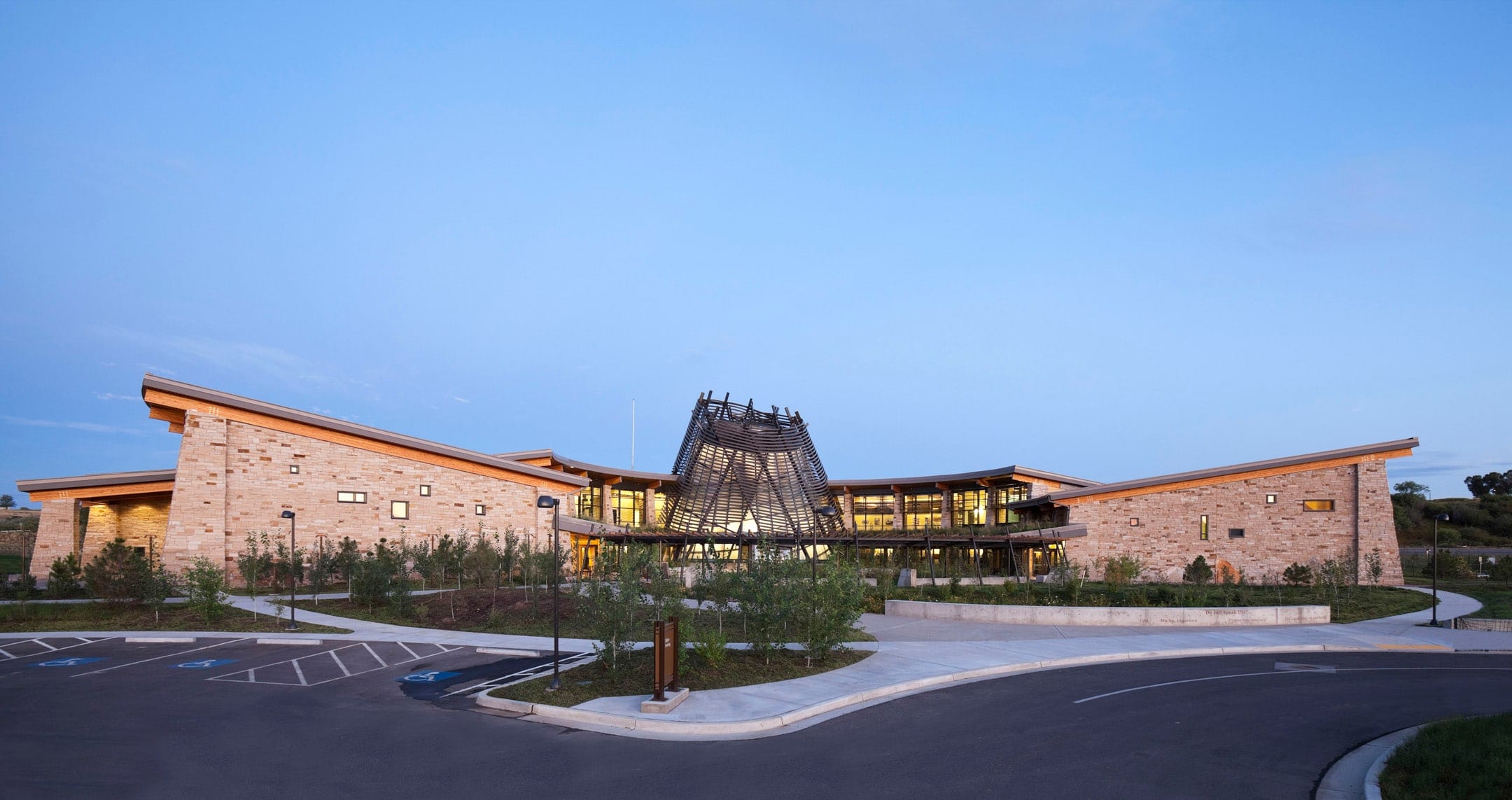 Southern Ute Cultural Center at dusk, its tower lit at the entrance