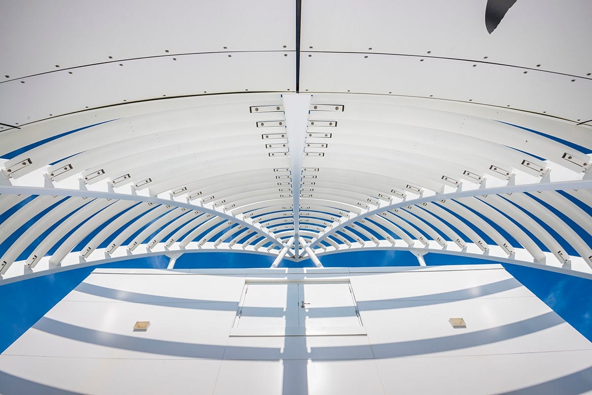 Inside the Exploration Tower at Port Canaveral: a curved white ceiling with blue bands