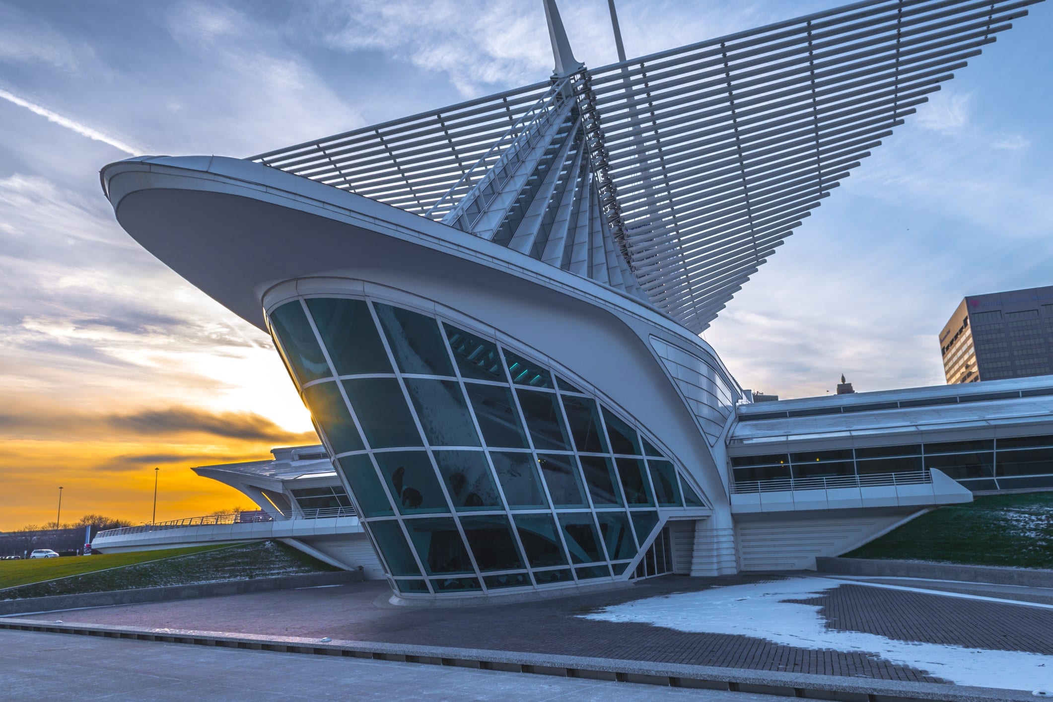 Milwaukee Art Museum's raised wings and glazed entrance at dusk