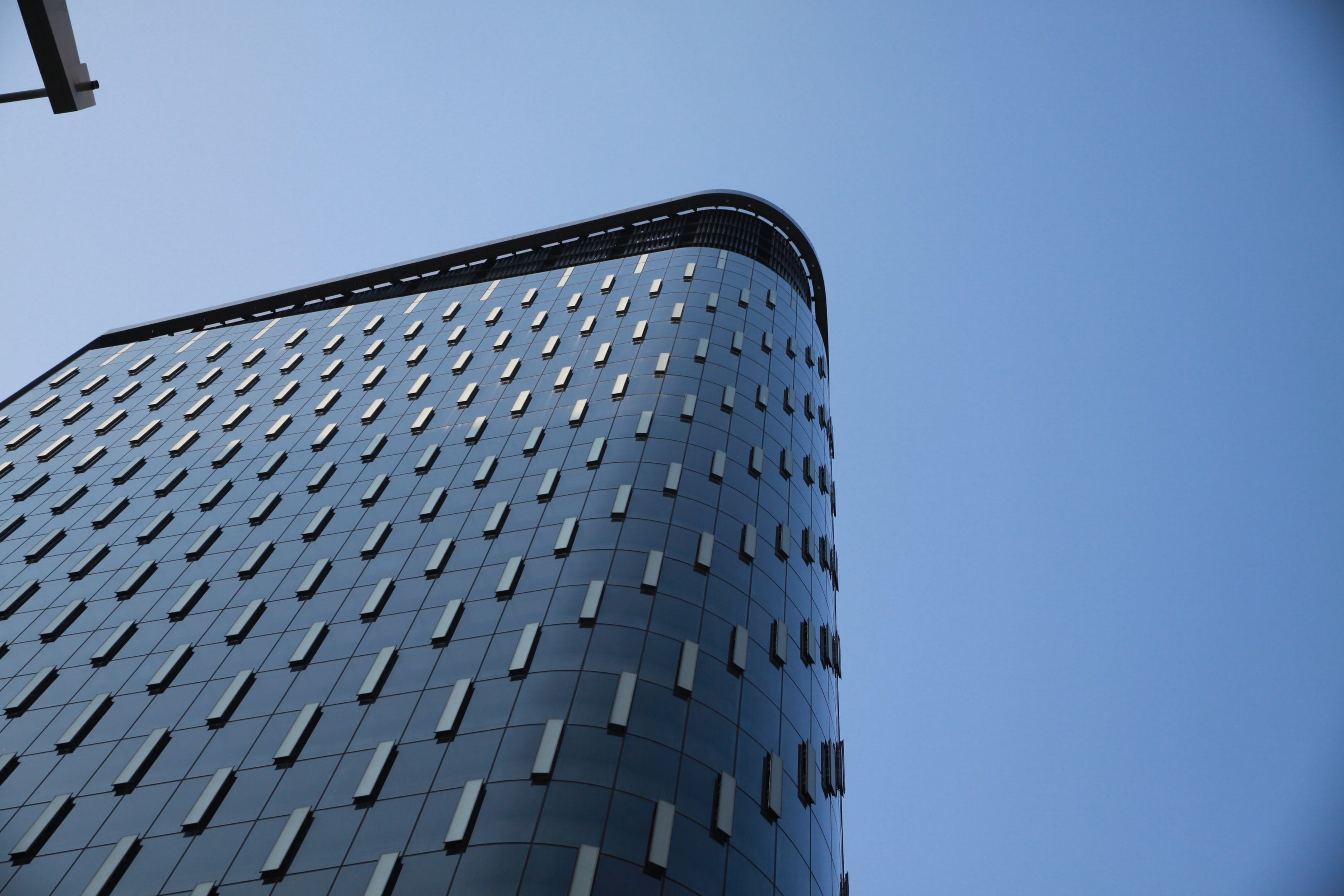 Patterned glass and vent panels wrapping the Tower at PNC Plaza's rounded corner