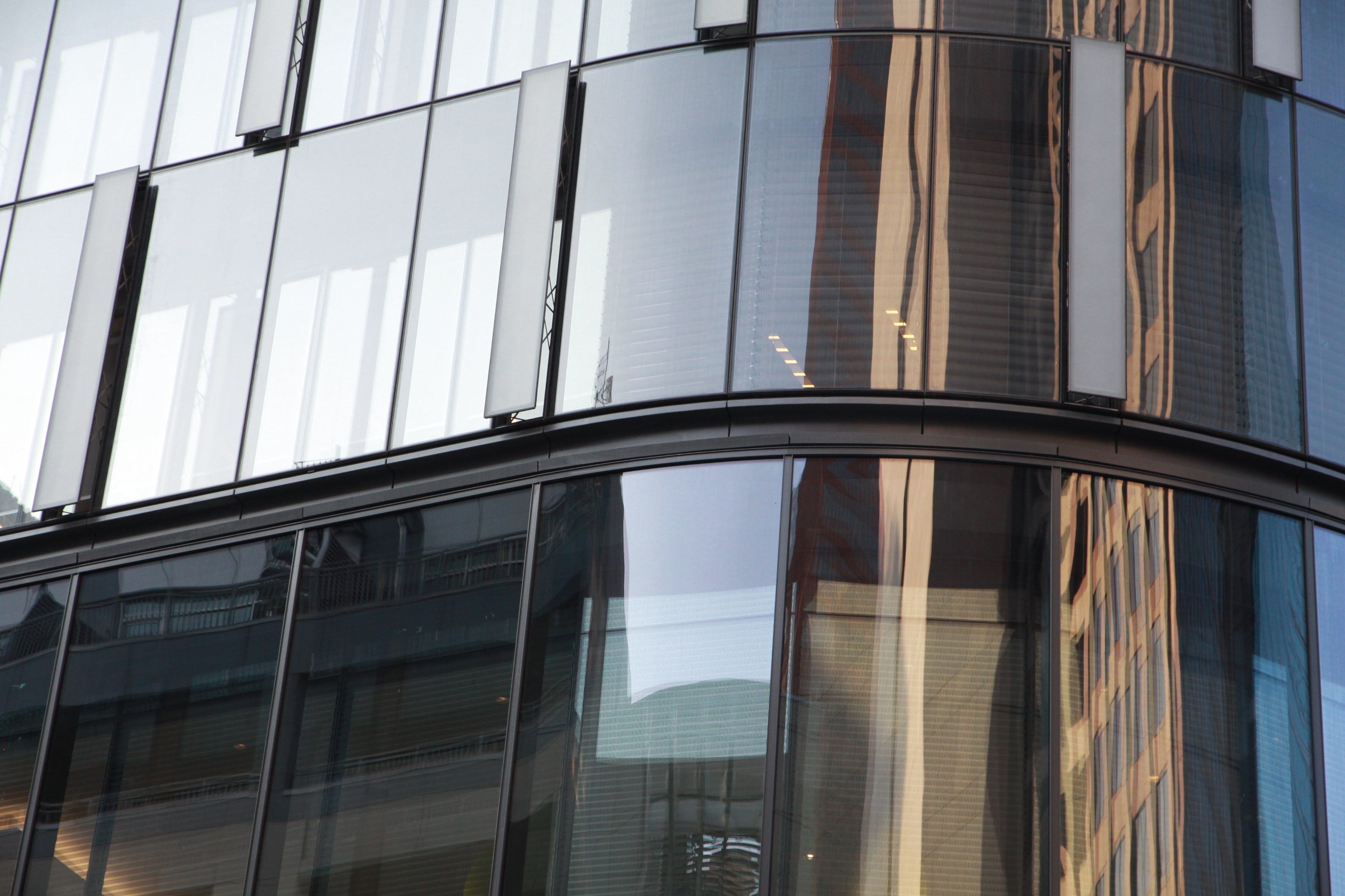 Curved glass at the base of the Tower at PNC Plaza