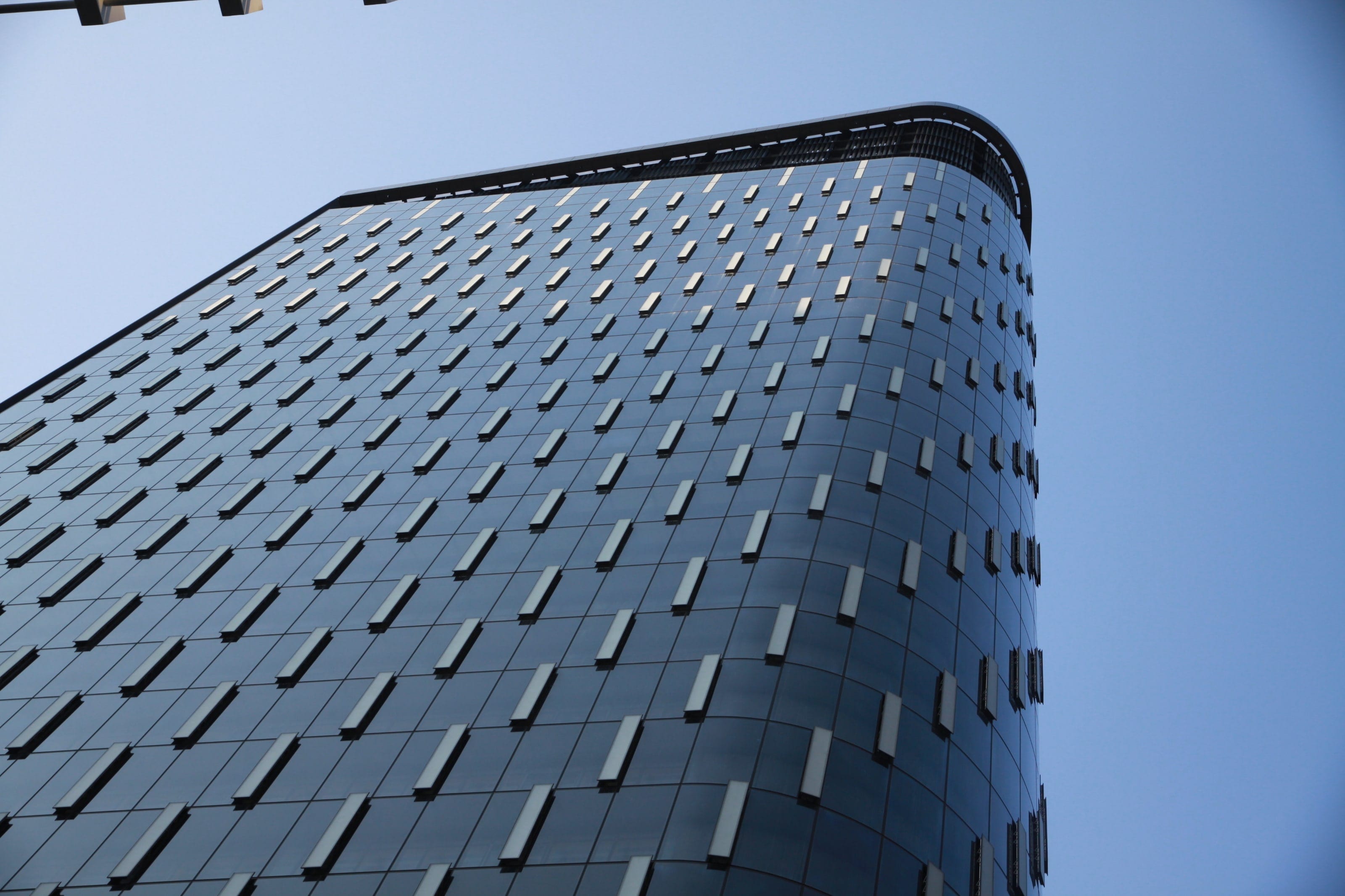 Patterned vent panels across the Tower at PNC Plaza's curved façade