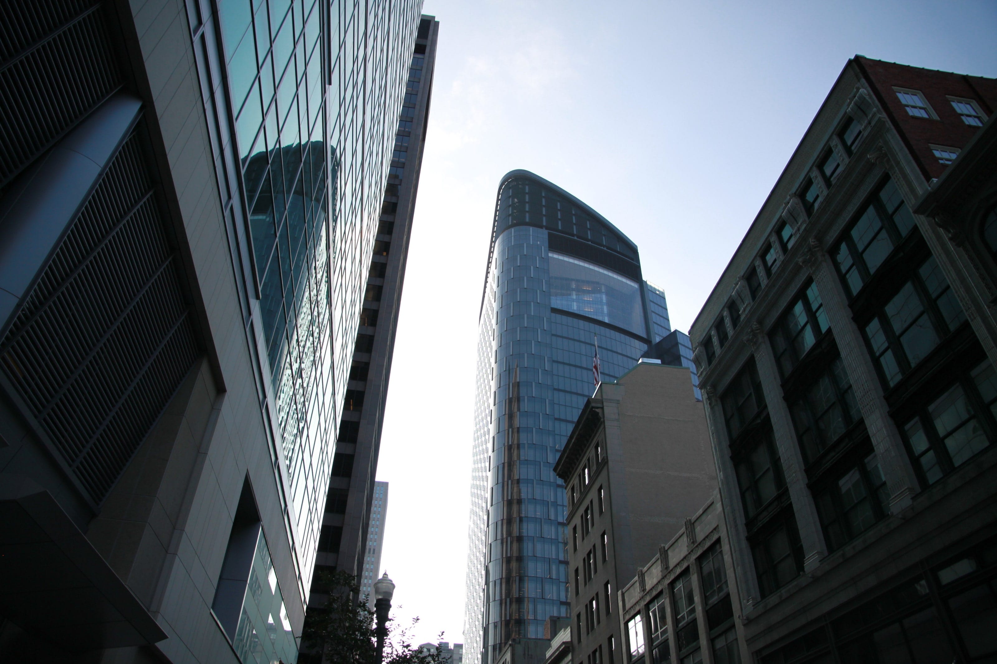 Tower at PNC Plaza seen between neighboring buildings in downtown Pittsburgh