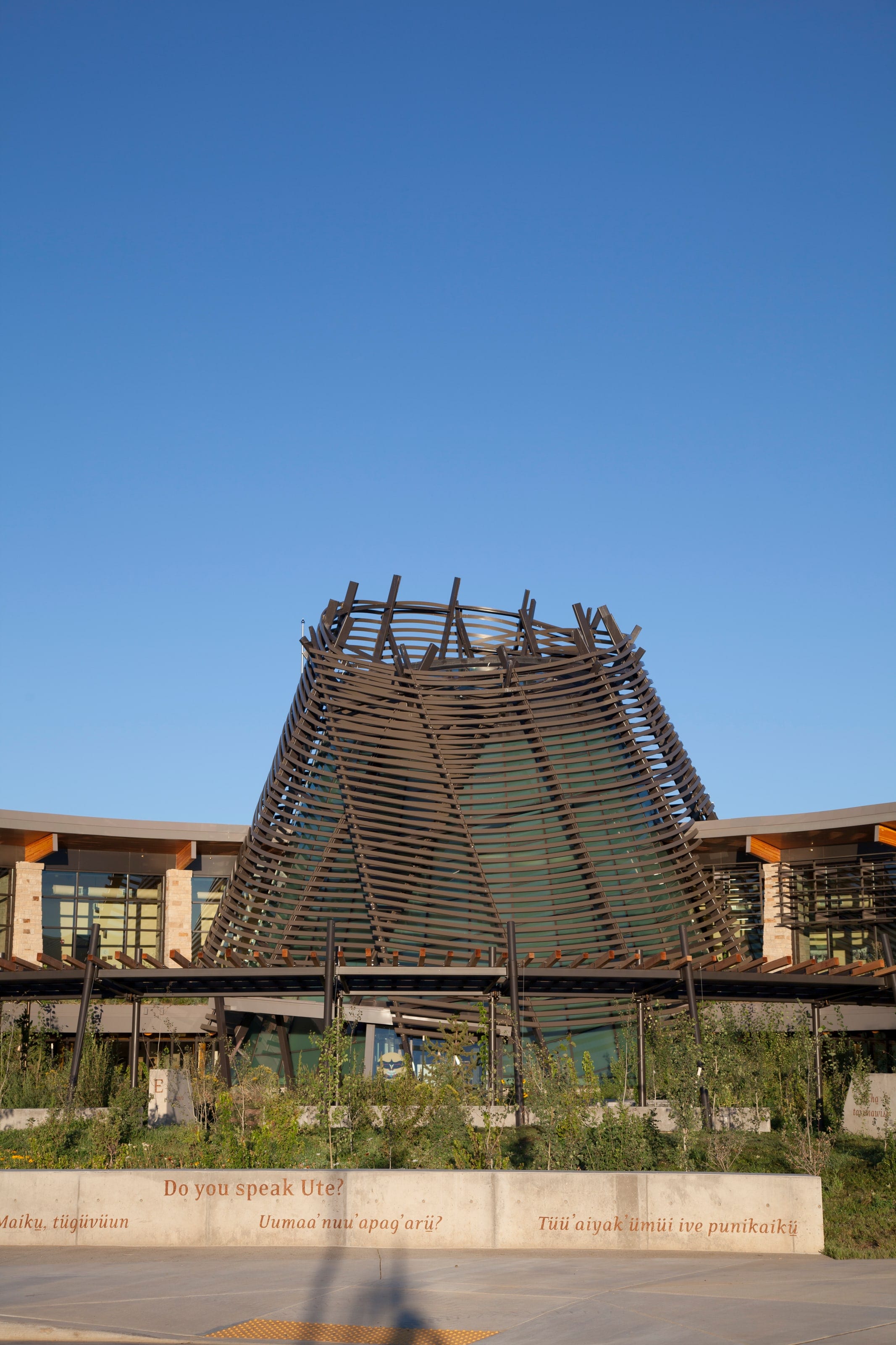 Southern Ute Cultural Center's slatted sunshade tower against a deep blue sky
