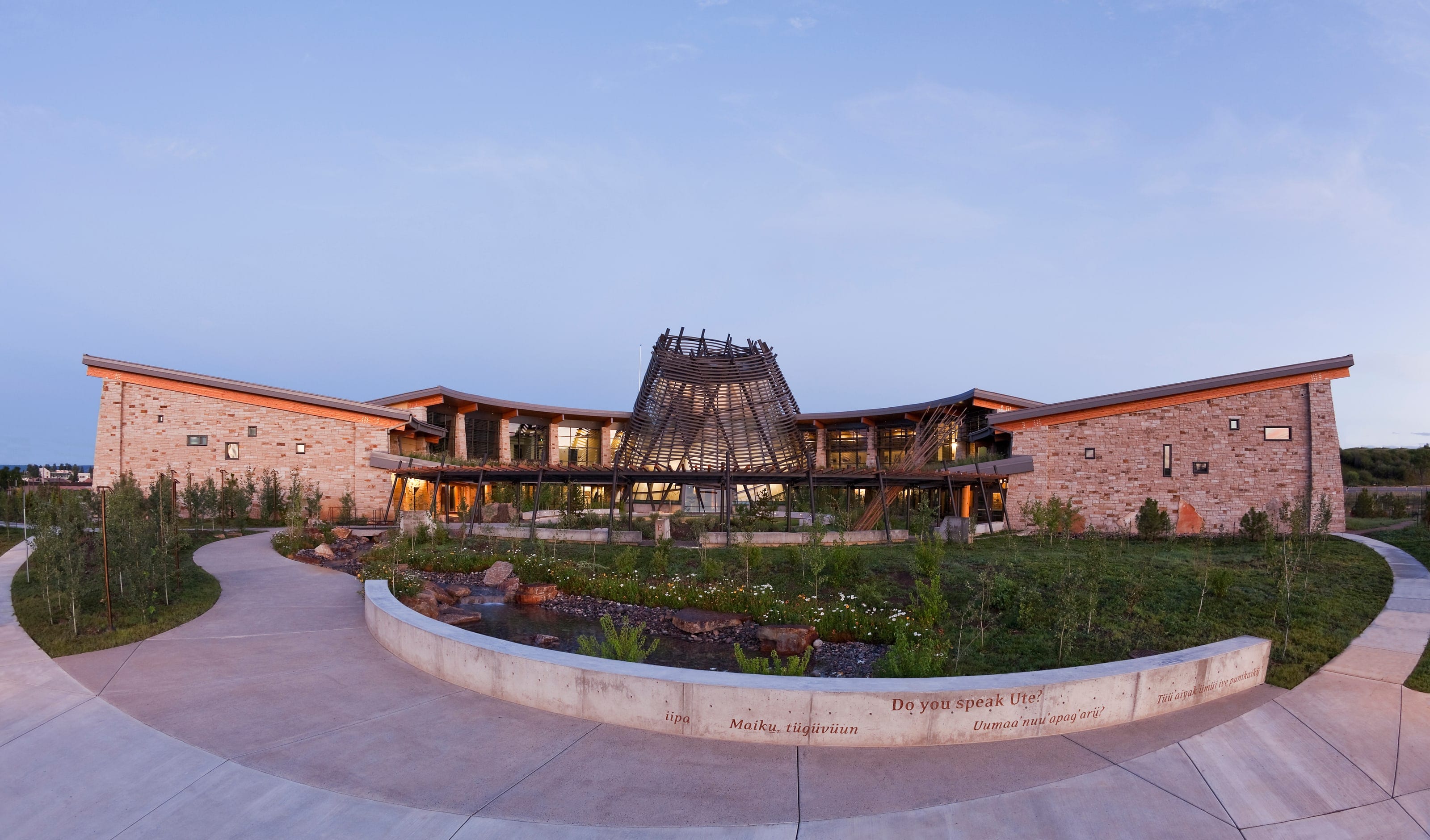 Southern Ute Cultural Center's circular plaza and sunshade tower at twilight