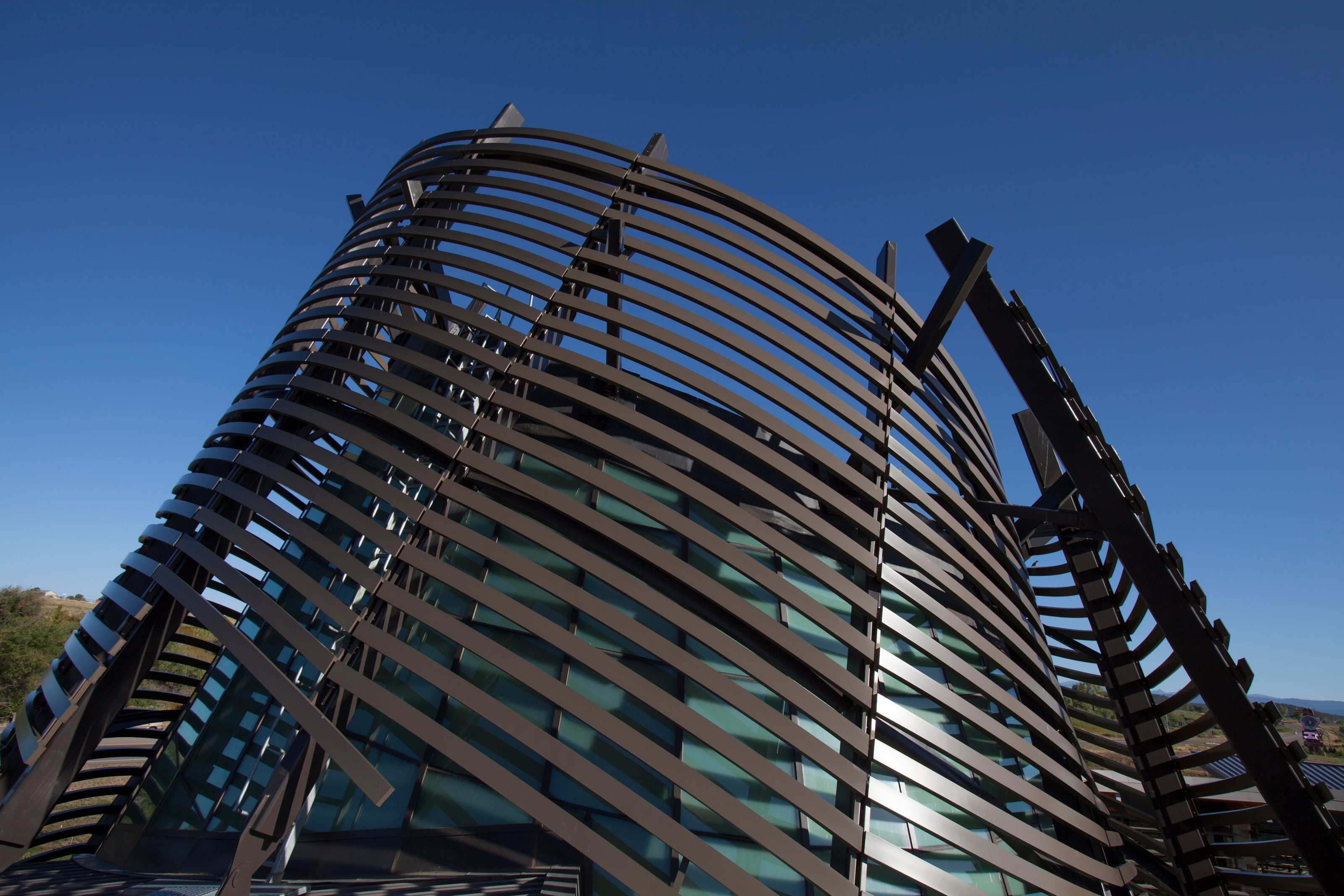 Southern Ute Cultural Center's slatted sunshade tower against a deep blue sky